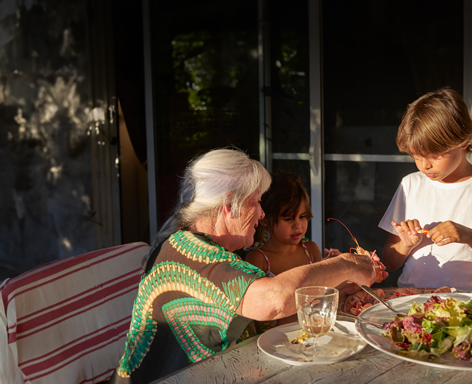 Family enjoying a mean outside